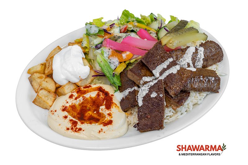 Beef Donair Plate with seasoned halal beef, rice, salad, pita, and Mediterranean sides – Shawarma & Mediterranean Flavors Edmonton.